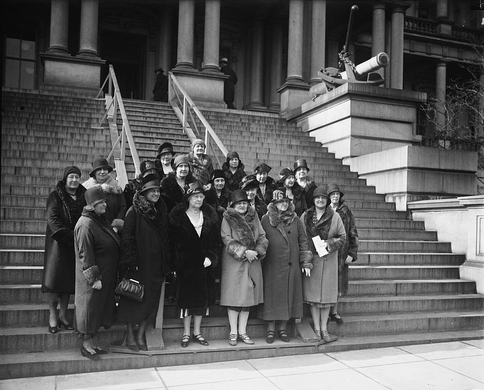 Black and white photographs of women wearing hats and coats, standing on steps