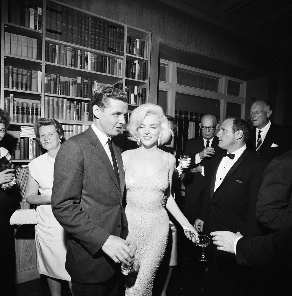 Black and white photograph featuring Marilyn Monroe in a sparkling nude-colored dress