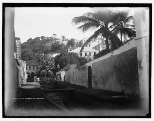 Black and white photograph of a street and houses in St. Thomas
