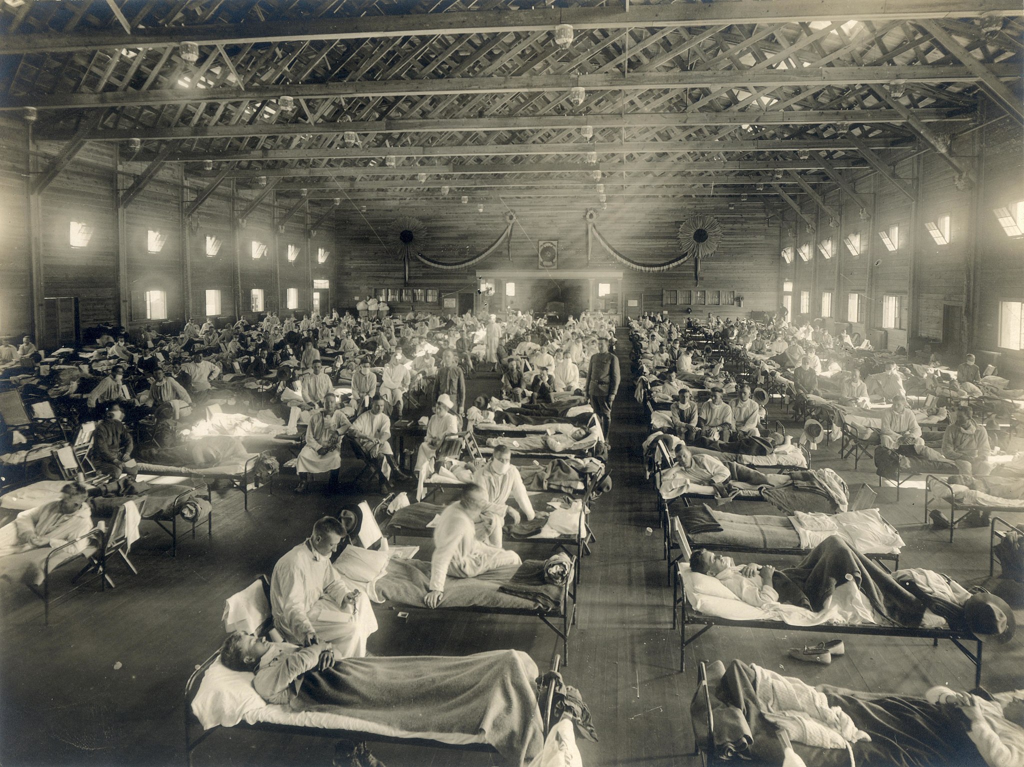 Black and white photograph of a large open hospital ward