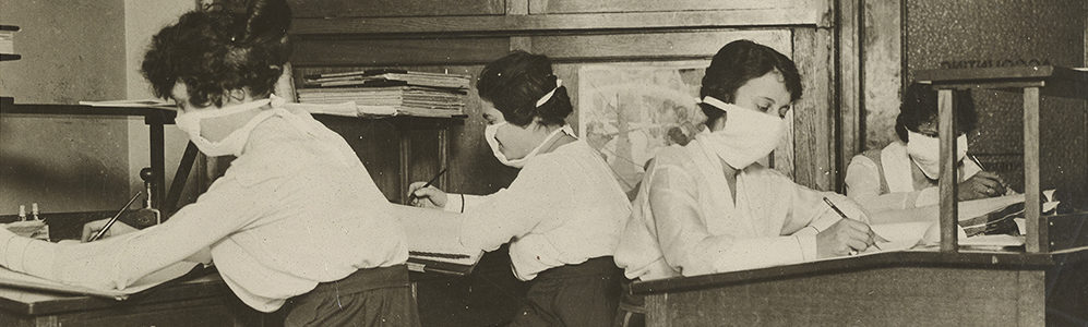 Clerks in New York City wearing masks at work