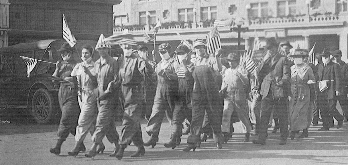 Men and women marching in WWI victory parade