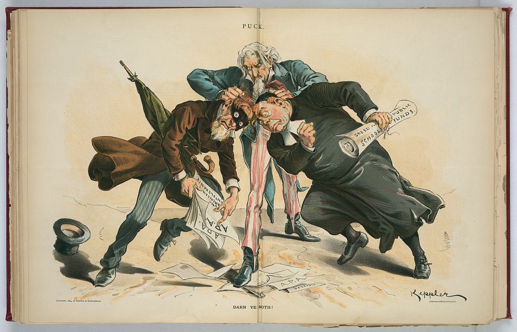 “Print shows Uncle Sam knocking the heads of two men together, a masked man on the left holding papers labeled ‘A.P.A. Un-American Intolerance’ and, on the right, a member of the clergy holding papers labeled ‘Greed for Public School Funds.’”