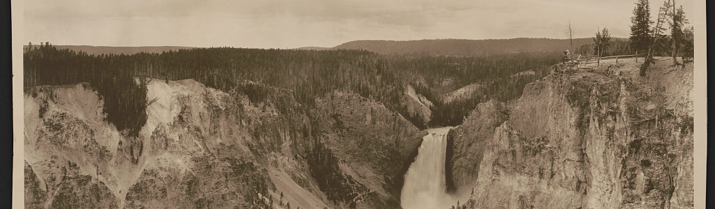Sepia toned photograph of waterfall and surrounding scenery